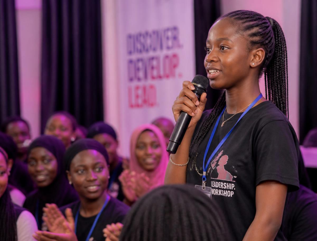 A teen girl speaking at a leadership workshop
